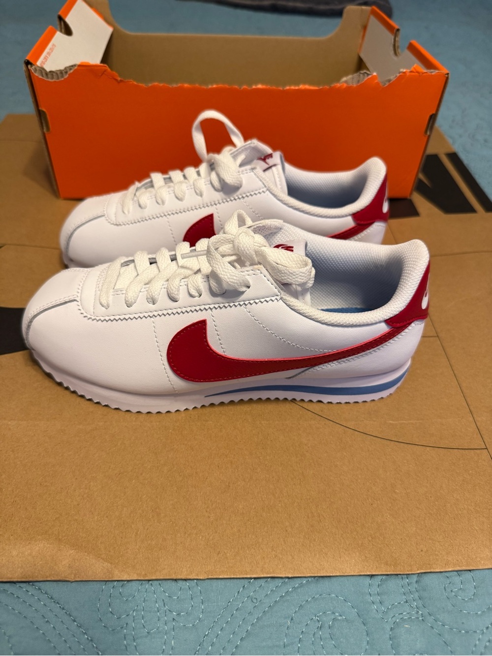 Nike Women’s Classic White Sneakers with Red Swoosh